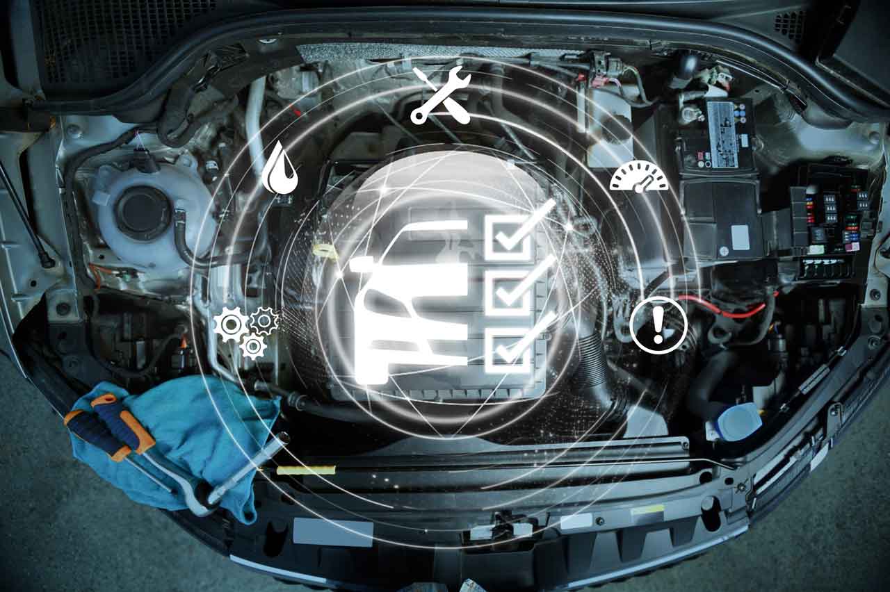 自動車のエンジンルームに、電子システムの点検や異常を示すアイコンが浮かび上がっているイメージ